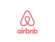 Airbnb logo with its distinct red symbol and typography on a white background