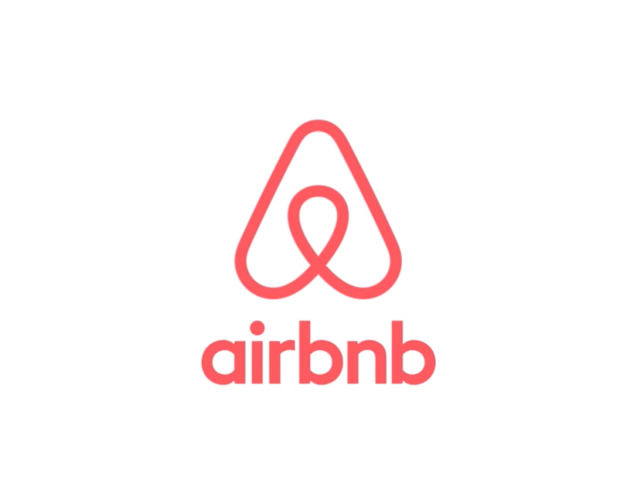 Airbnb logo with its distinct red symbol and typography on a white background
