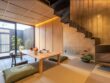 A modern Japanese dining room with tatami mats and stairs.