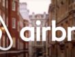 The inscription "Airbnb" on the background of buildings