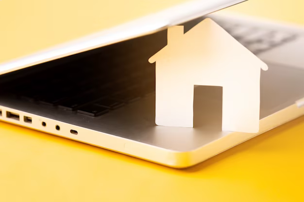 House figurine covered with laptop lid