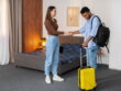 Man Checking to Apartments with a Luggage